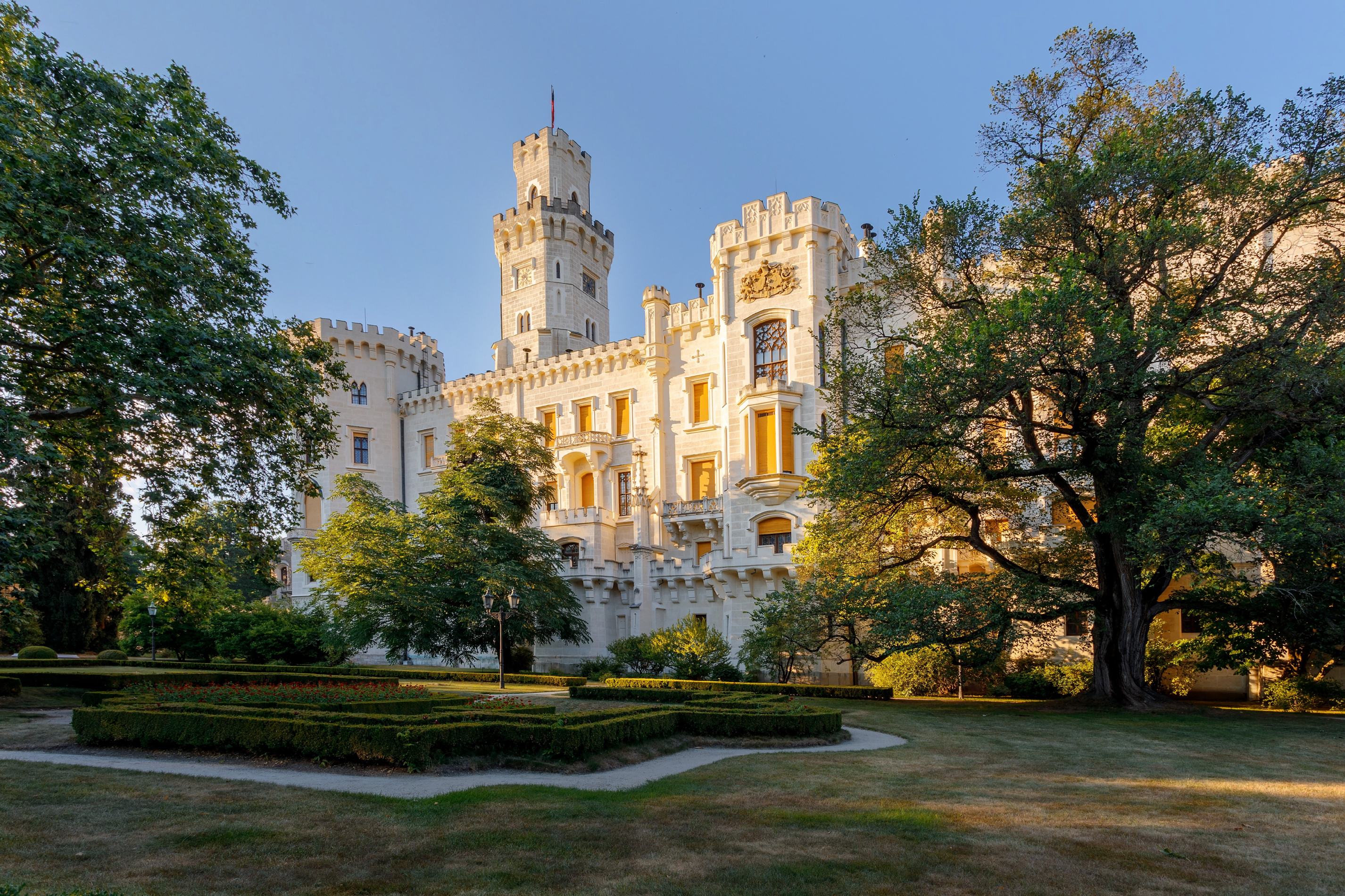 Hluboká Castle in the afternoon light — panoramic view from the castle park