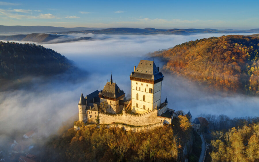 Karlštejn Castle in Morning Fog – Aerial View over Bohemian Karst