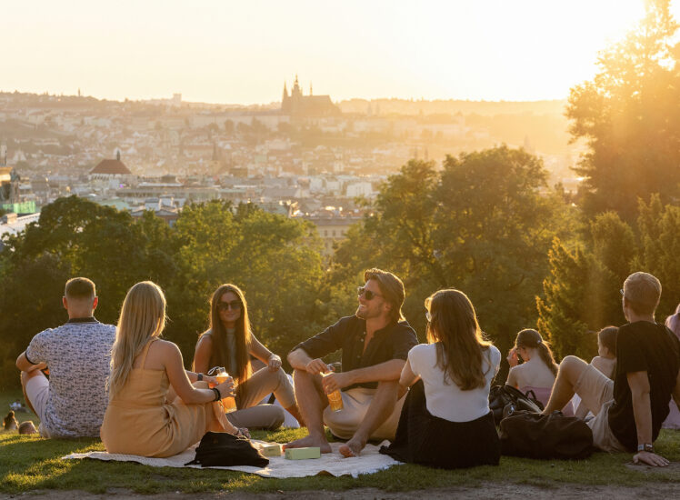Summer picnic in Prague park with view of Prague Castle