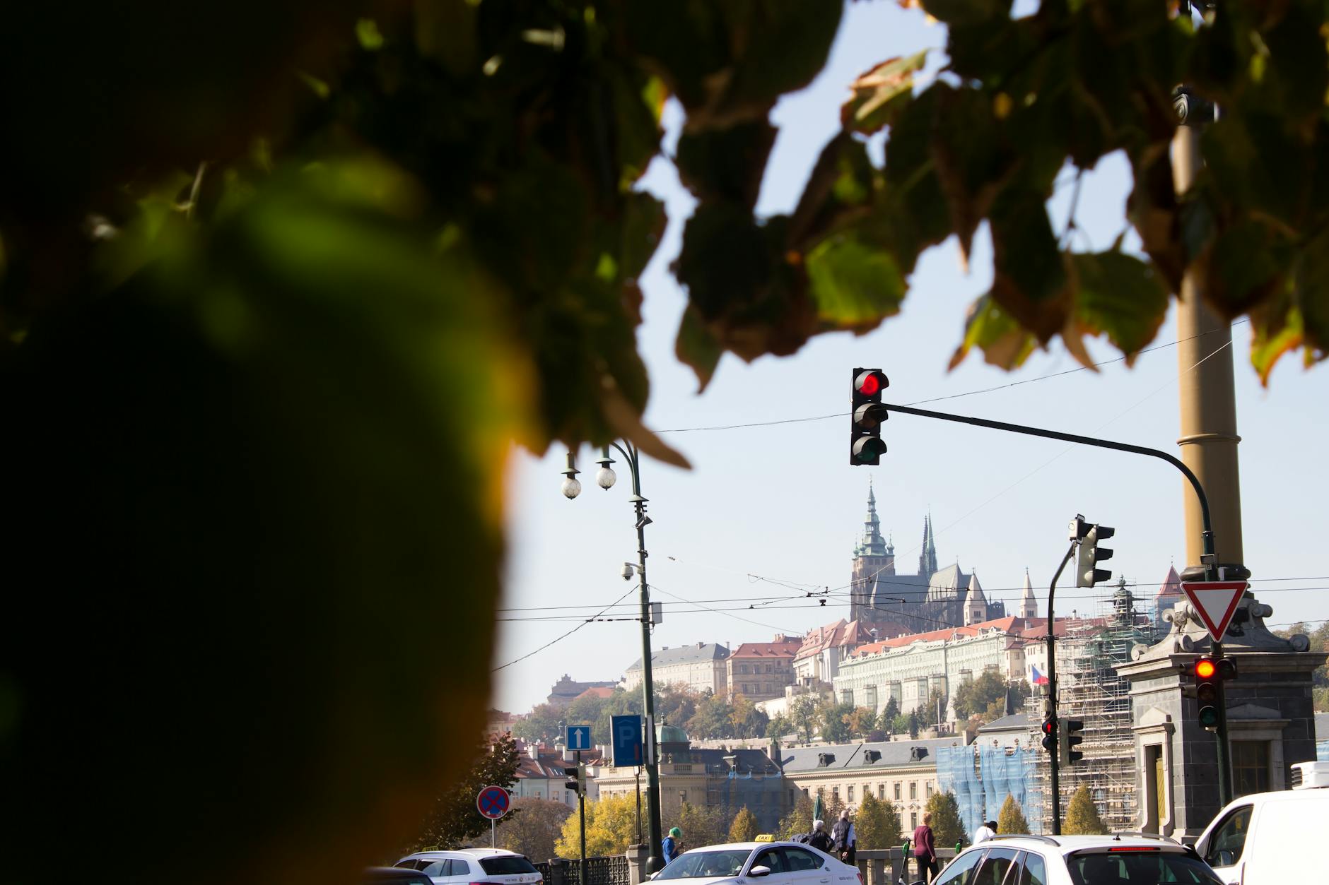 Czech countryside road with castle on hilltop in autumn