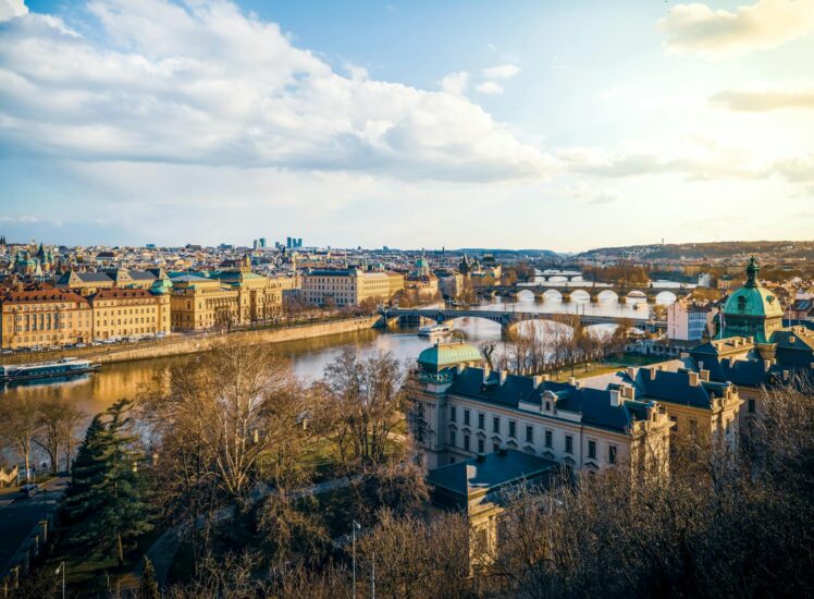 Aerial view of Prague city centre with Vltava River and Czech landscape beyond