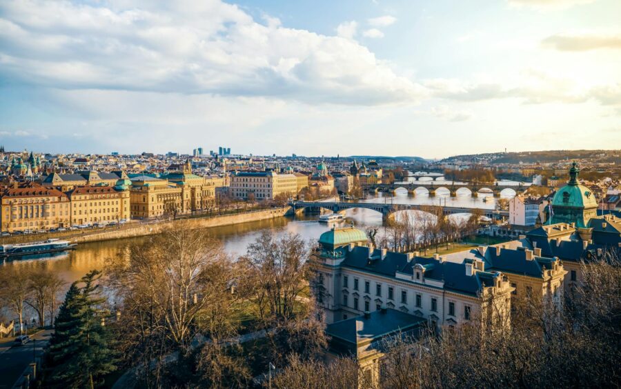 Aerial view of Prague city centre with Vltava River and Czech landscape beyond