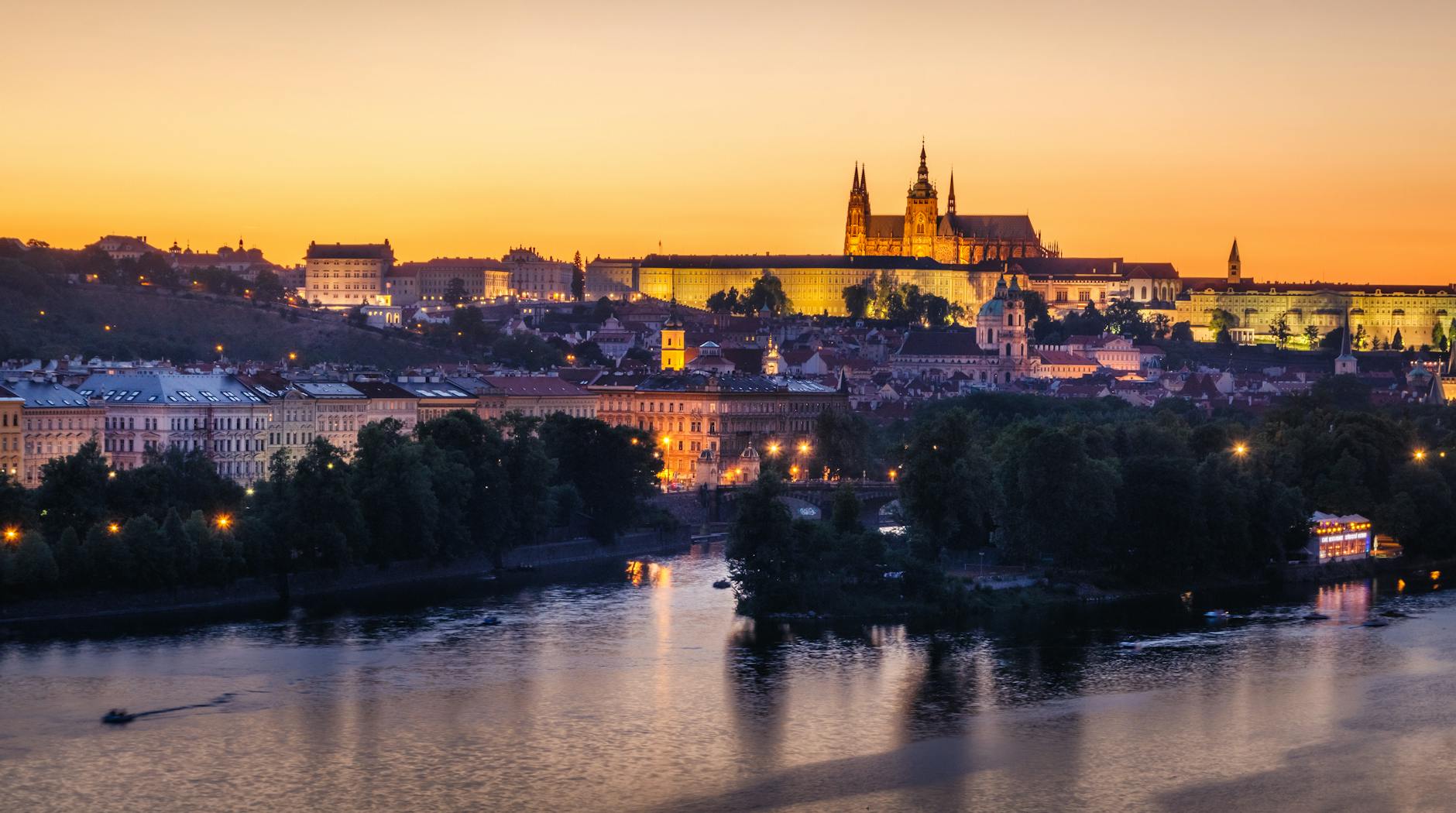 Panoramic view of Prague Castle and St. Vitus Cathedral at golden hour