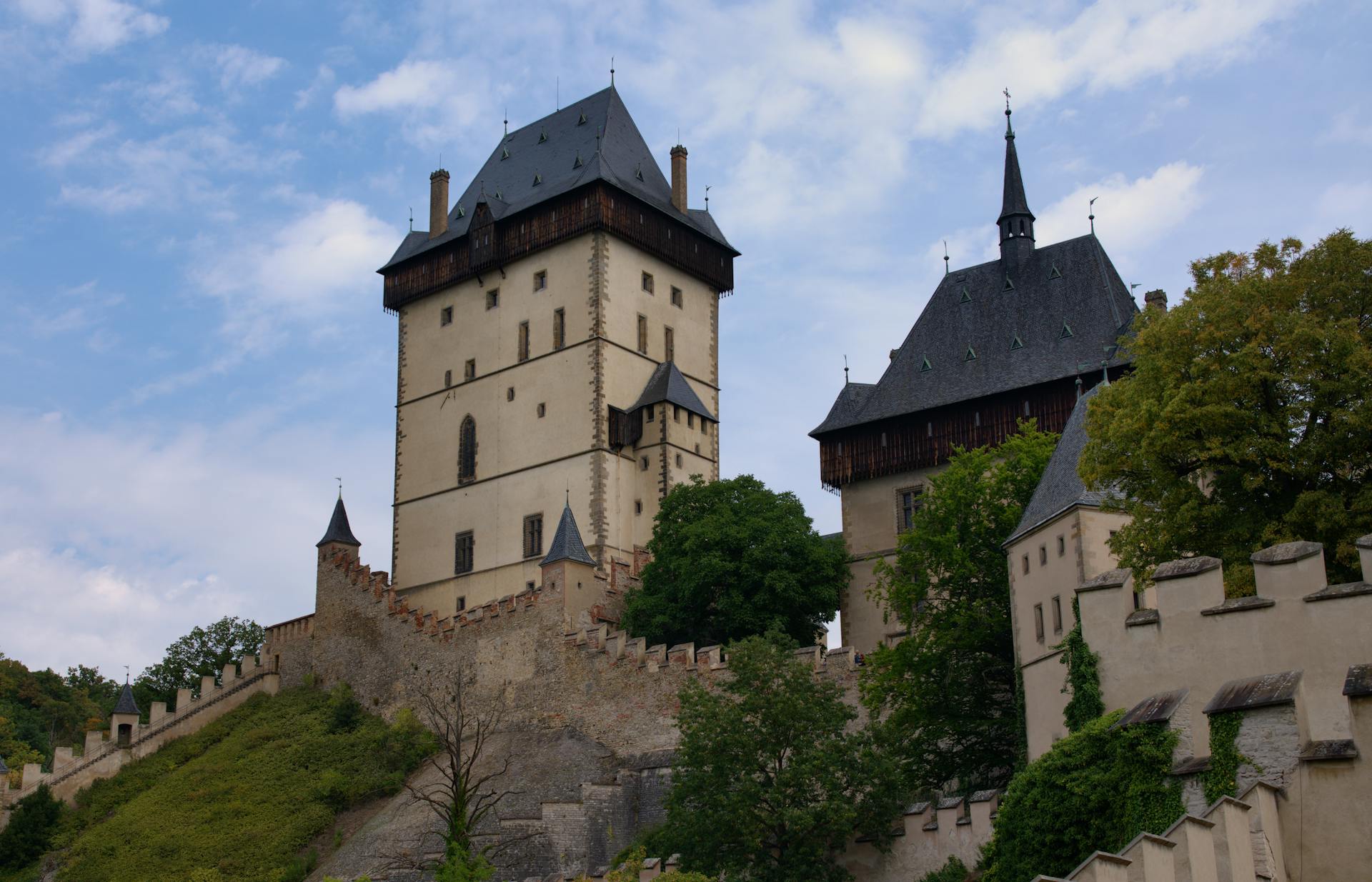 Karlštejn Castle nestled in a lush green landscape in Czech Republic — ideal day trip from Prague