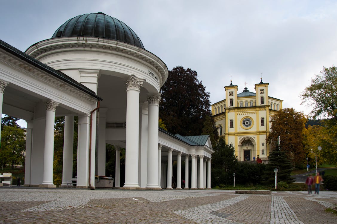 Mariánské Lázně spa colonnade with church in the background, Czech Republic