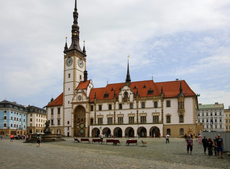 Historic Upper Square in Olomouc with Town Hall and lively city life Czech Republic