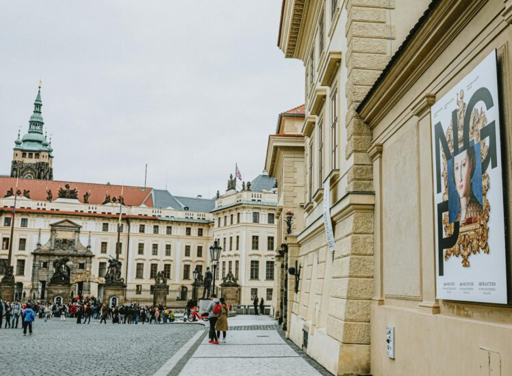 Tourists exploring Prague Castle courtyard with St. Vitus Cathedral — private tour experience in Prague, Czech Republic (Photo: Helena Jankovičová Kováčová via Pexels)