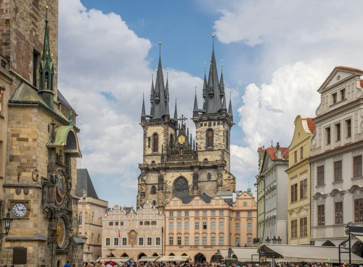 Prague Old Town Square with Tyn Church gothic spires and historic buildings