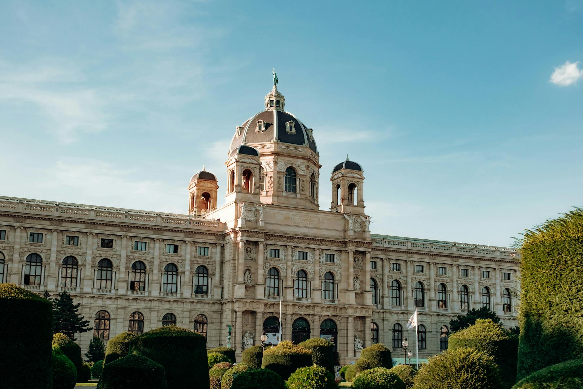 Kunsthistorisches Museum in Vienna Austria with spring trees under clear blue sky