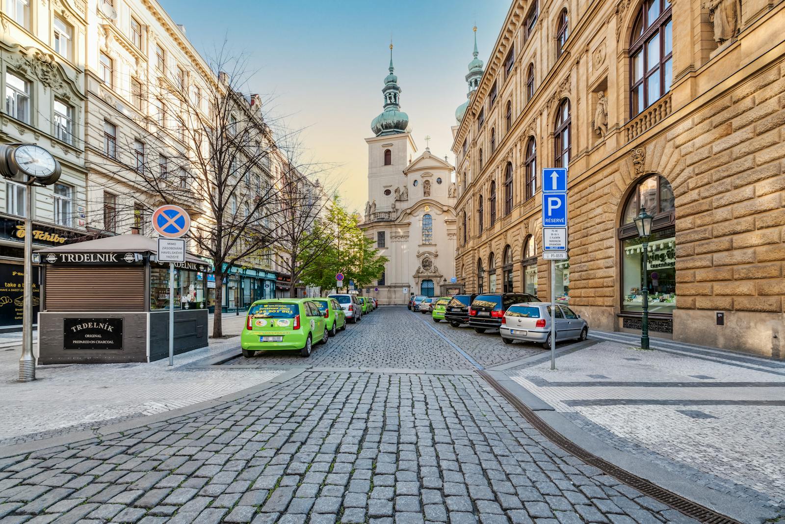 Historic cobblestone alley in Prague old town with view of St. Havel Church — typical walking street in central Prague