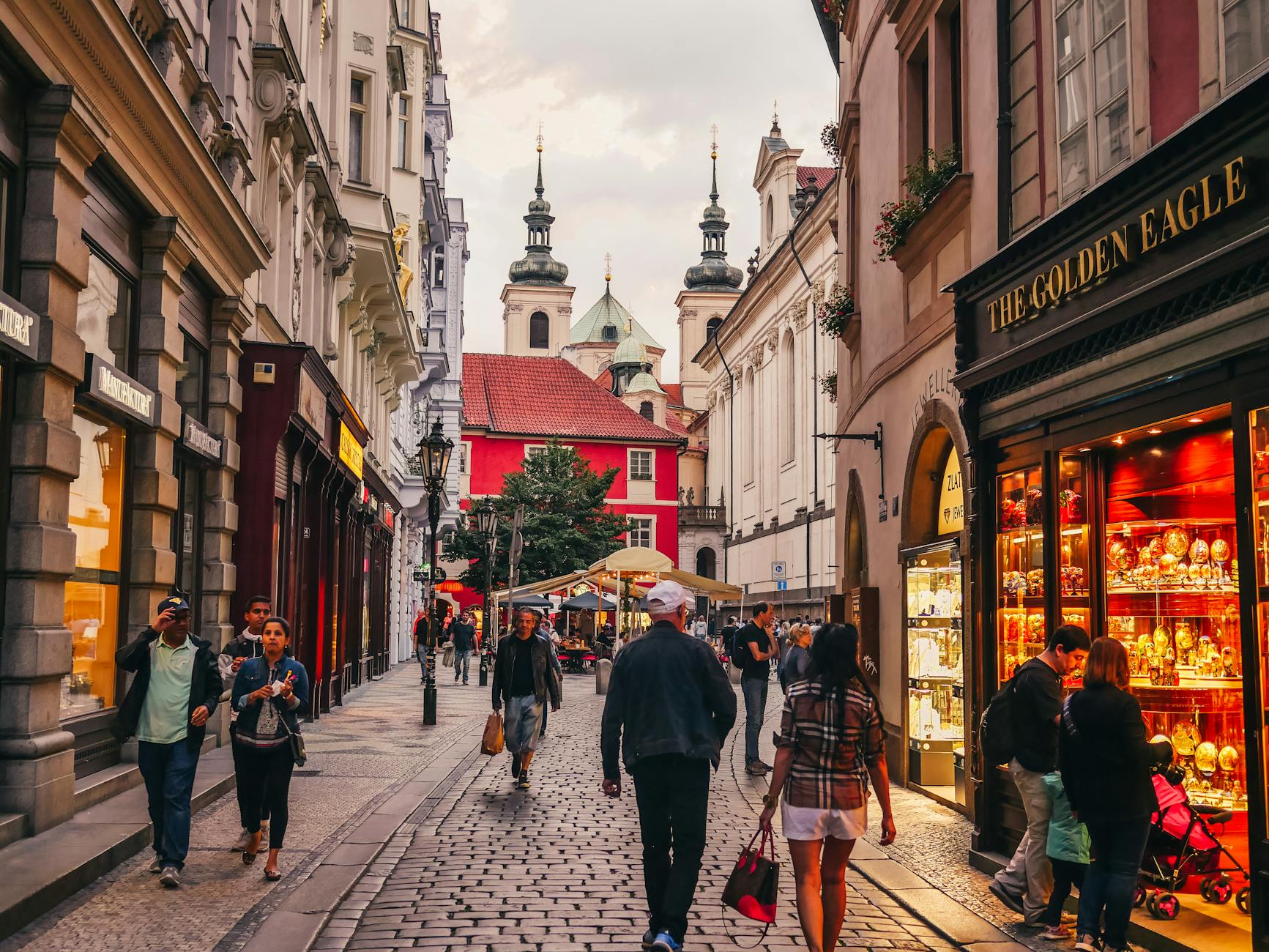 Tourists walking on cobblestone streets in Prague Old Town during a private city tour