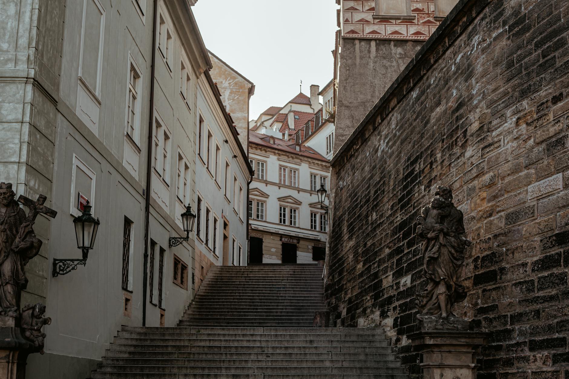 A view of a historic stairway in Prague's charming Old Town with classic architecture.